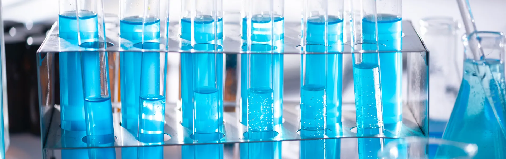 Test tubes with blue liquid substance in them