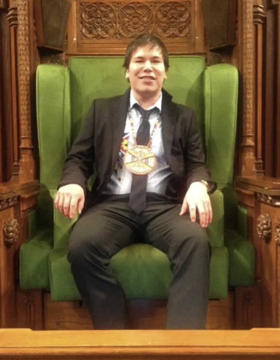 Paskwa Lightning sitting in a chair.