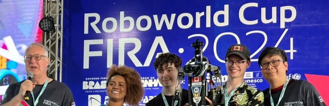 Group of students and their professor at the awards ceremony